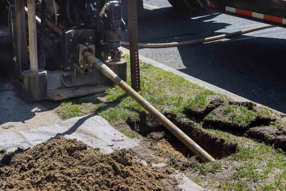 plumbing team working on a trenchless sewer repair project